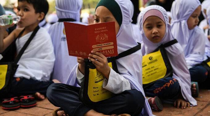 Malaysia gives each student in school aid Malaysia gives each student in school aid