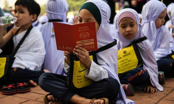 Malaysia gives each student $33 in school aid
