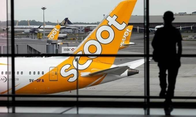 Chinese man charged with stealing 5 from passenger on flight to Singapore
